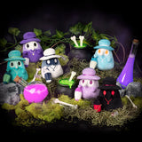 Set of colorful Halloween-themed figurines with a dark background