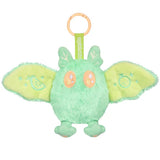 Green plush toy with orange accents on a white background