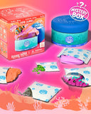 Slime World's Oceanic Series Mystery Box set featuring a colorful product box, a blue-lidded slime jar, and several unsealed foil packets containing pink slime, green beads, gray slime, and a pink striped worm, all arranged on a pink ocean-themed background.
