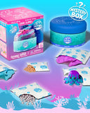 Oceanic Beasts Slime Worlds Mystery Box set featuring a pink and blue retail box, a teal slime jar, and multiple white slime bags with colorful slime and beads shown, on a blue-to-purple underwater-themed background.