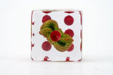 Decorative ceramic dish with red polka dots and a green and red floral design on a white background