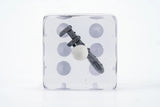 Clear cube with a hair tie inside on a white background