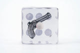 Decorative pillow with a gun design on a white background