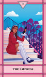 Tarot card featuring a woman sitting on steps with a cat, titled 'The Empress'.