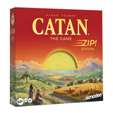 Board game box for 'Catan' with a sunset over a landscape design.