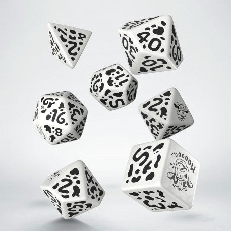 Set of dice with black  cow patterns on a white background