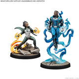 Two miniature figures on stands with colorful energy effects against a white background.