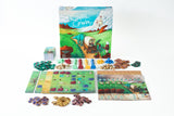 Board game set with colorful components and a box featuring a scenic design on a white background