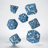 Blue and white patterned dice set on a light gray background