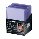 Box of Ultra Pro 3x4 Platinum Toploaders with a clear toploader stack on a white background.