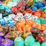 Assorted colorful dice with different numbers and designs.