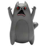 A gray cartoon cat figurine with raised paws, large red eyes, and an open mouth showing teeth, photographed against a plain white background.