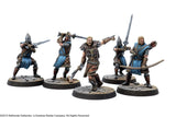 Five painted miniature figures of fantasy warriors on a white background