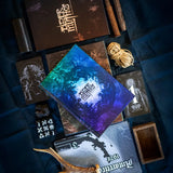 Collection of ' elder mages' books and items on a dark fabric background