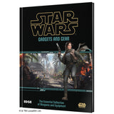 Star Wars Gadgets and Gear hardcover book on a plain white background. The cover is predominantly black with the Star Wars logo in gold at the top, teal text, and a central illustrated scene showing a female character in a desert battle setting.