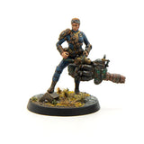 Miniature figure of a character with a weapon on a white background