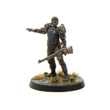 Miniature figurine of a warrior holding a weapon on a white background