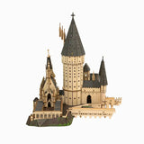 Wooden model of a castle with multiple towers on a white background