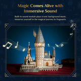 A 3D block puzzle model of Hogwarts Castle from Harry Potter, illuminated with warm lights against a dark blue background. Animated musical notes float around the model, and text at the top reads 'Magic Comes Alive with Immersive Sound'.