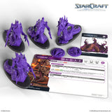 Purple game figures and cards from StarCraft on a white background