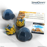 StarCraft game components including miniatures and cards on a white background