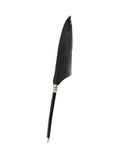 A black feather quill pen with a black handle and a small silver-toned decorative ring, shown vertically on a plain white background.