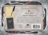 Back cover of the Game of Thrones House Stark Desktop Stationery Set, featuring a rustic medieval-themed design with a gray stone texture, parchment panels, red leaves, a quill pen, and a notebook.
