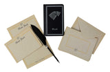 A Game of Thrones themed stationery set featuring a black notebook with the Stark direwolf emblem, beige envelopes, matching letterhead cards, and a black quill pen on a white background.