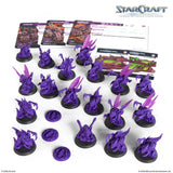 Collection of purple game pieces and cards with 'StarCraft' branding on a white background.