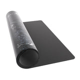 Black gaming mouse pad with a rolled-up black and gray mouse pad on top