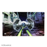A rectangular Star Wars collectible playmat featuring a dynamic graphic of a TIE fighter flying through a starry space corridor with green laser beams. The Star Wars and Gamegenic logos are visible on the bottom left and right corners of the playmat.