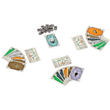 Collection of card games and metal pieces on a white background