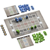 Board game setup with pieces and maps on a gray board