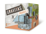 Box packaging for the Gravitas Travel Site game, featuring stone stacking imagery and text including 'Strategic Stone Stacking', '4 Player Game', and 'Art You Can Play With' on a white studio background.