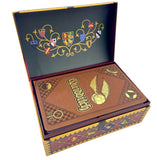 Decorative box with intricate designs and emblems on a white background