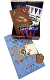 Collection of Harry Potter-themed items including a notebook, pins, and a card in a decorative box.