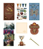 Collection of Quidditch-themed merchandise including a notebook, posters, and decorative items.