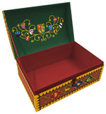 Decorative box with Hogwarts school crests on a green lid and red interior.