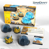 StarCraft tabletop miniatures game set with box, miniatures, and cards on a white background