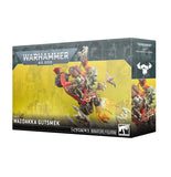 Warhammer 40,000 figurine packaging with Wazdakka Gutsmek on a yellow background