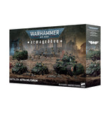 Warhammer 40,000 Armageddon game box with military vehicles and figures on a desert battlefield.