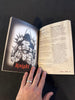 Open book with a black and white illustration of a knight and the word 'Knight' on a dark background.