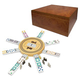 A dominoes game set with a round wooden track and many white tile sets arranged in a circle, alongside a polished wooden storage box on a plain white background.