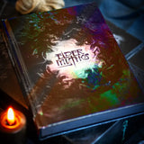 Book titled 'Elder Mythos' with a colorful cover, lit by a candle.
