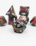 Black dice set with floral designs on a white background