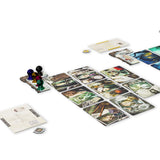 Board game setup with cards and figures on a white background
