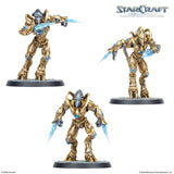 Three gold and blue warrior figurines from StarCraft on a white background
