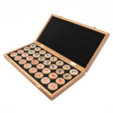 Wooden box with Chinese characters on wooden stamps