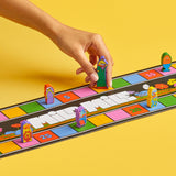 Colorful board game with player tokens on a yellow background