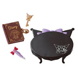 Set of decorative items including a diary, key, pen, and small table with cat design on a white background